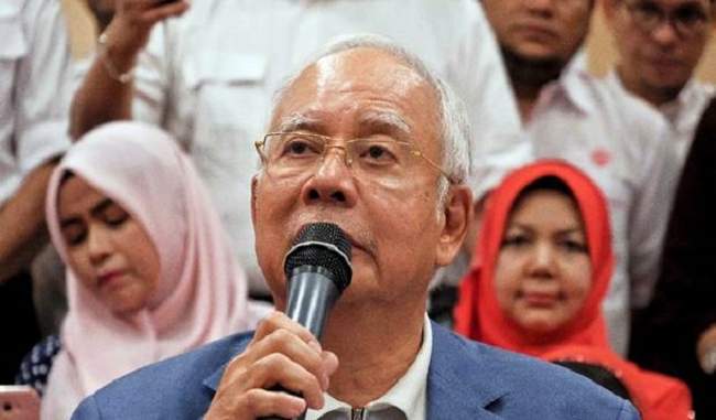 Ousted Malaysian leader Najib Razak quits as leader of party, barred from leaving country Ousted Malaysian leader Najib Razak quits as leader of party, barred from leaving country