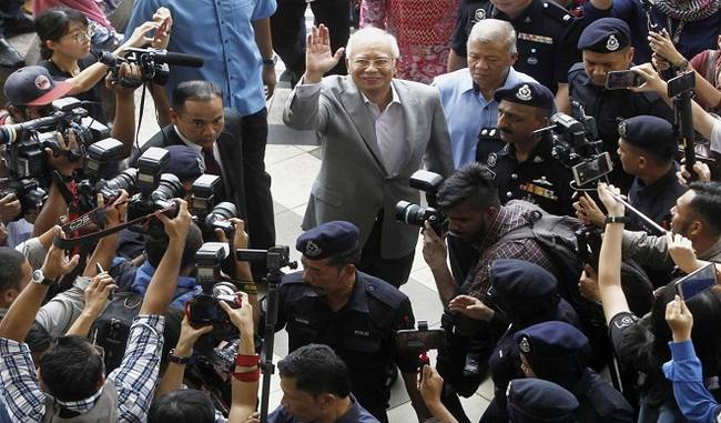 Malaysia says mastermind behind 1MDB looting fled Macau