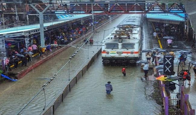 Navy evacuates stranded commuters from a railway station in Mumbai