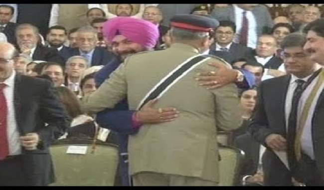 sidhu-hugs-pak-army-chief-sits-next-to-pok-head-at-imran-oath-taking