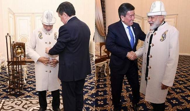 kyrgyzstan-president-gifts-traditional-hat-coat-to-pm-narendra-modi
