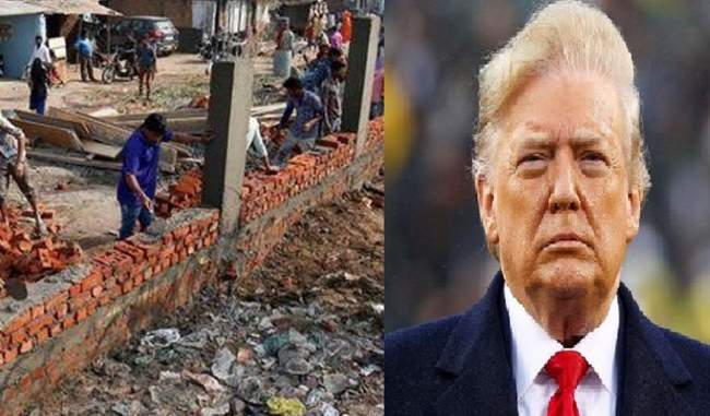 high-walls-being-built-to-hide-slums-from-trumps