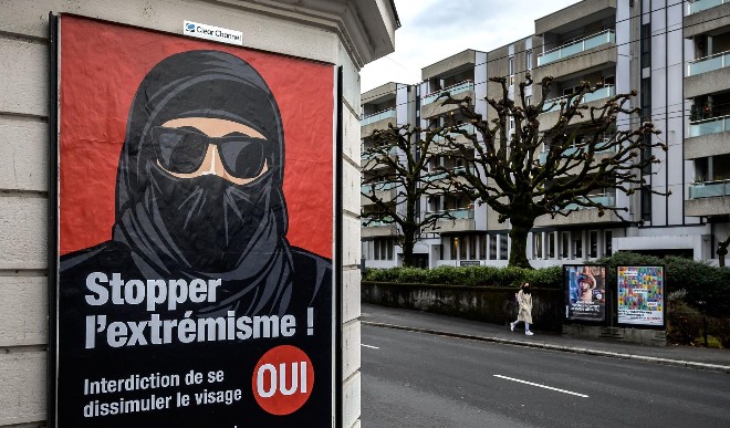 Switzerland votes to ban burqa in public